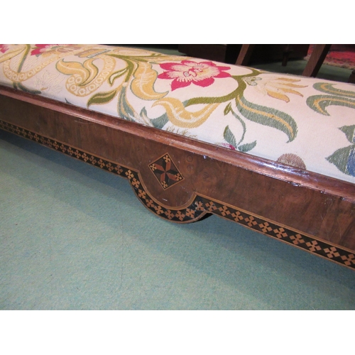 4170 - A 19th Century walnut marquetry fireside footstool with later upholstery, 125cm long