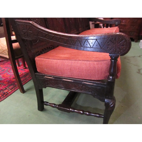 4180 - A 17th Century and later oak five panel back rest settle with carved decoration having a central her... 