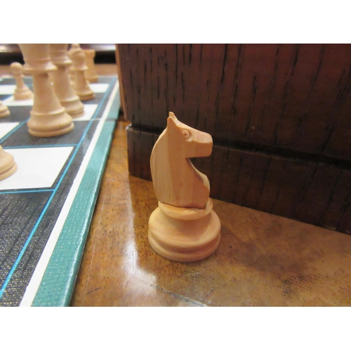 4189 - A wooden chess set and wooden draughts set with a Spear's Games board