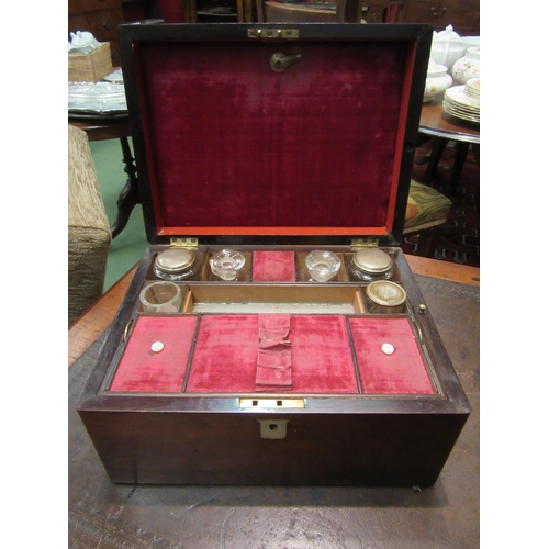 4195 - A rosewood work box with mother-of-pearl inlay, glass bottles (a/f) to original interior