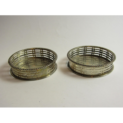 4382 - A pair of Sampson Mordan & Co. silver pierced coasters, Chester, 8cm diameter