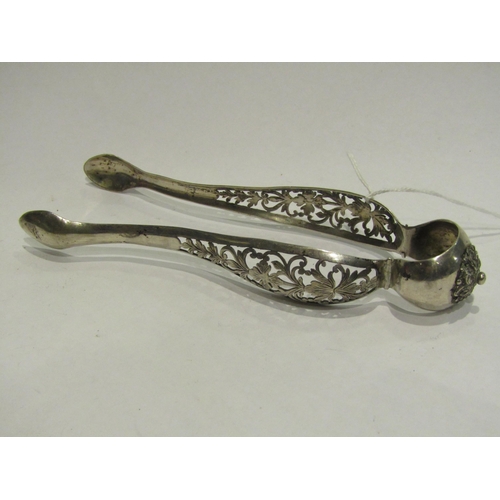 4388 - A pair of Austrian silver tongs, ornate pierced detail