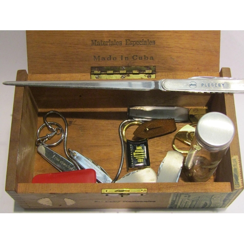 4391 - A tub of miscellaneous items including gold fillings, coins, penknives and rulers