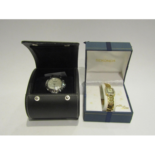 4394 - An Ingersoll stainless steel cased wristwatch with mother-of-pearl face, together with a ladies Seko... 