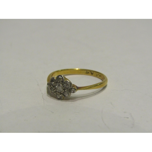 4442 - An 18ct/platinum small diamond daisy ring