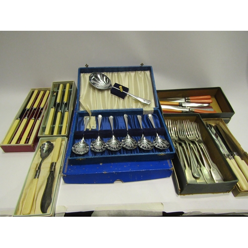 4477 - A collection of stainless cutlery, boxed (8)