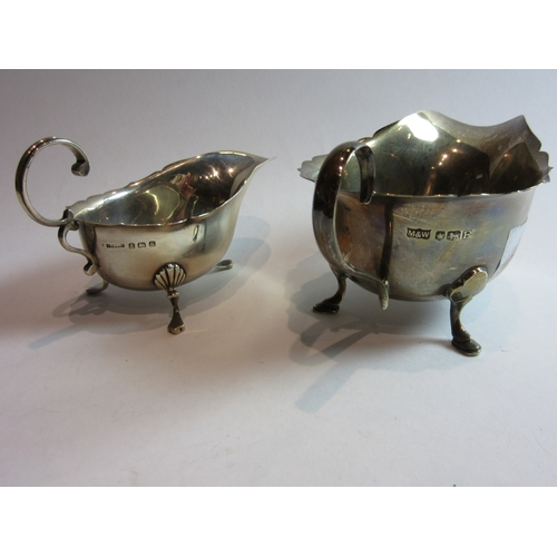 4379 - Two silver cream jugs on tripod feet including Mappin & Webb