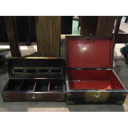 4237 - Two wood and lacquer boxes with gilded brass mounts