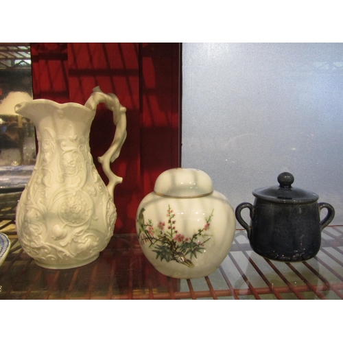 4498 - A selection of ceramics including Staffordshire figures, Parian jug, cottage and four blue glasses e... 