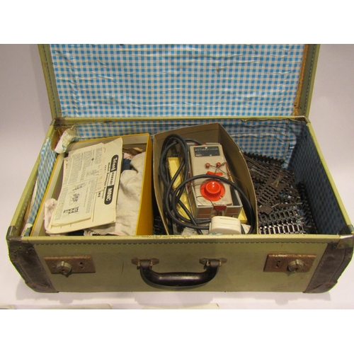 4506 - A suitcase containing '00' gauge railway items including track, locos, wagons etc.