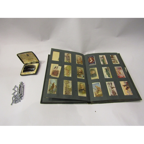 4334 - A box of miscellaneous to include wooden cigarette box with tambour sides, Ronson lighter, album of ... 