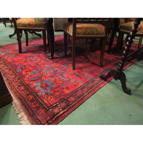 4510 - A Persian Tribal Rugs red ground geometric and floral design rug with multiple borders and tasselled... 