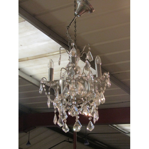 4511 - A five arm chandelier with glass drops