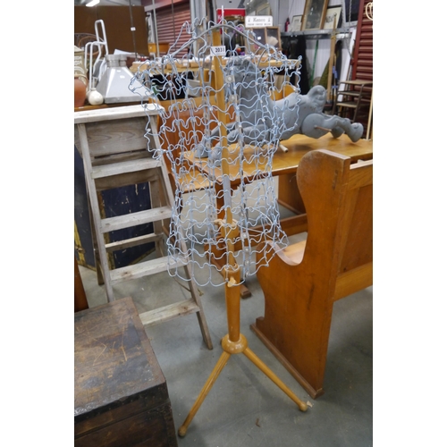 2438 - A 1950's beech and wirework manequin on tripod stand