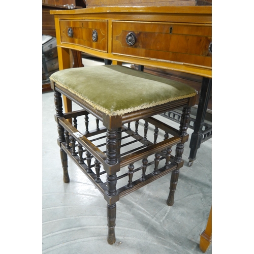 2130 - An Edwardian music stool with turned details and green velvet upholstery