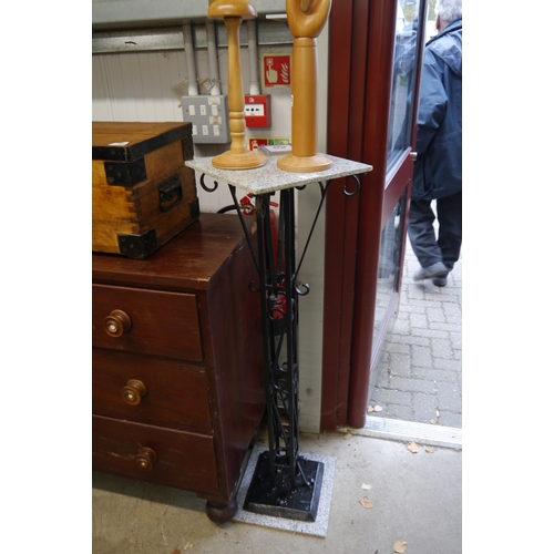 2081 - A wrought iron jardiniere stand with granite base and top