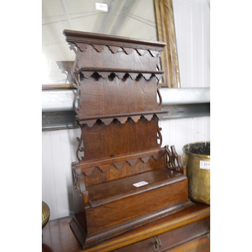 2109 - An oak pipe or spoon rack