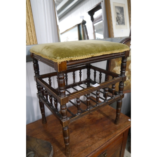 2130 - An Edwardian music stool with turned details and green velvet upholstery