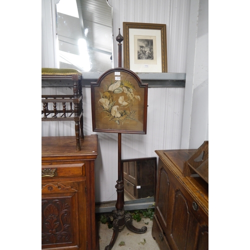 2134 - A 19th Century pole screen with needlepoint panel, tripod base, glass cracked