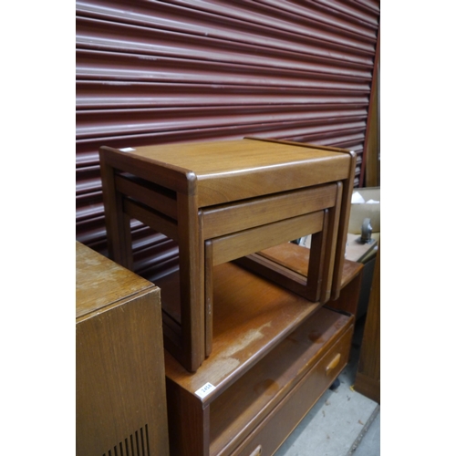 2461 - A 1970's teak nest of three fitting tables