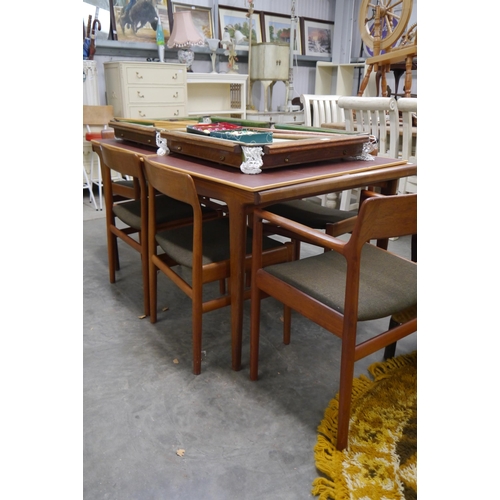 2434 - A teak dining table and six chair frames