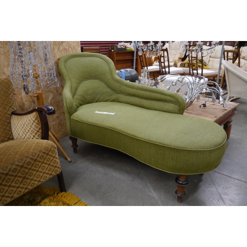 2439 - A Victorian green upholstered daybed on walnut legs