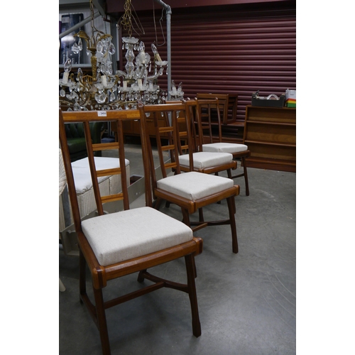 2450 - A set of four Mid-century teak sculptural dining chairs