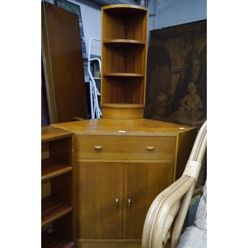 2455 - A mid-20th Century G-Plan style corner secretaire cupboard and a set of open corner shelves and side... 