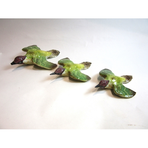 6004 - A set of three Beswick Green Woodpecker wall plaques, model no's. 1344/1 a/f, 1344/2 and 1344/3 a/f.