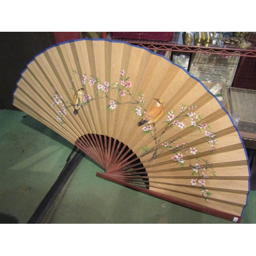 1143 - A large hand painted Oriental decorative fan with bird and flower design, 100cm long and 180cm wide ... 