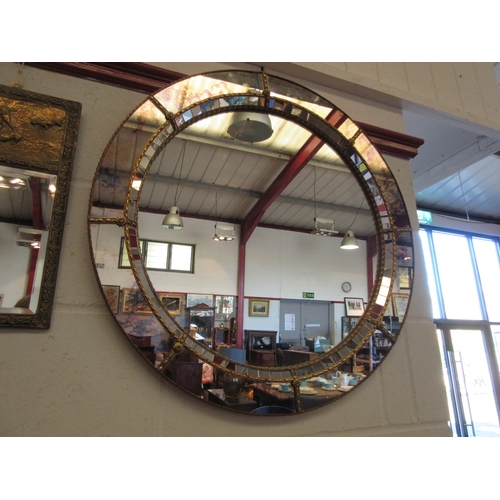 1027 - A decorative circular mirror, 70cm diameter