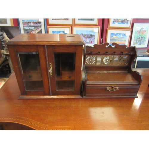 1100 - A vintage smoker's cabinet with glazed doors (with key) and a wooden smoker's pipe stand