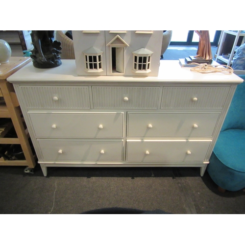 1121 - A modern white side unit with three over four drawers, 90cm tall x 144cm wide x 45cm deep