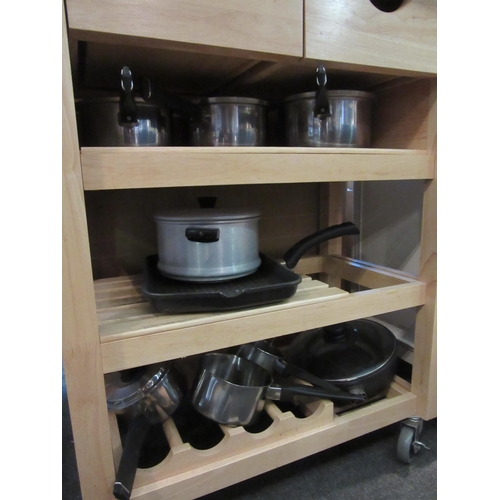 1125 - A beech kitchen island with pan contents