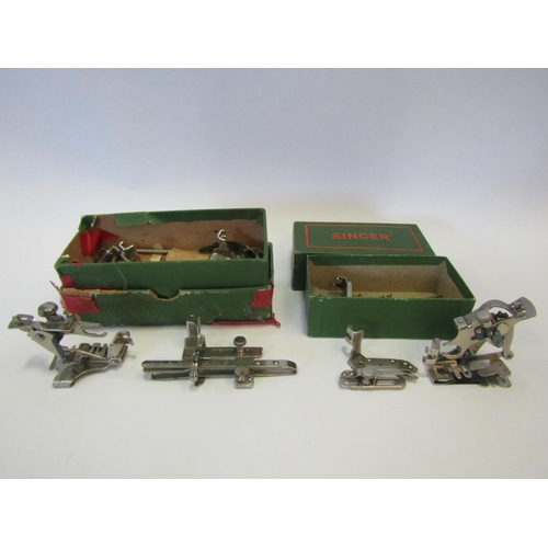 1281 - Two small Singer boxes containing sewing machine accessories