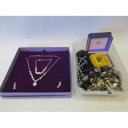 1338 - A box of bijouterie to include a necklace and earrings suite set with garnet, stamped 925, shell nec... 