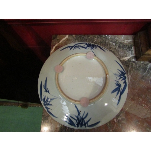 4136 - A pair of Oriental blue and white Blossom tree design chargers, 37cm diameter