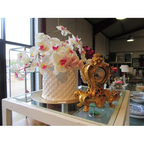 1209 - Decorative ornaments including faux flowers, gilt clock and crystal items (8)