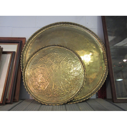 1227 - Two Indian brass decorative trays, largest 67cm diameter