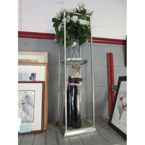 1261 - A galvanised steel and glass stand with a Princess Diana doll and faux roses, stand 90cm tall