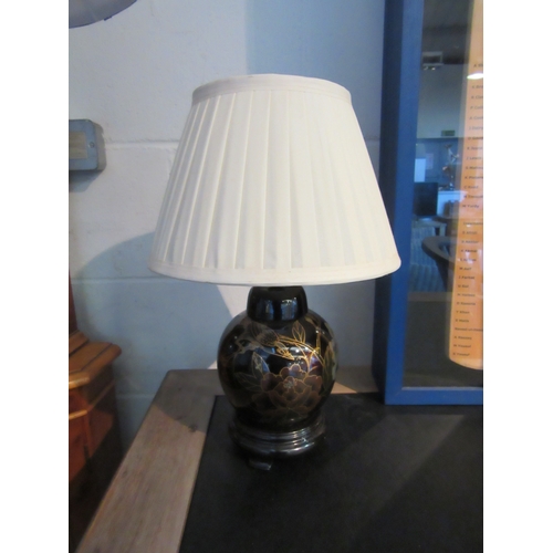 1006 - A pair of Oriental design table lamps with fluted shades