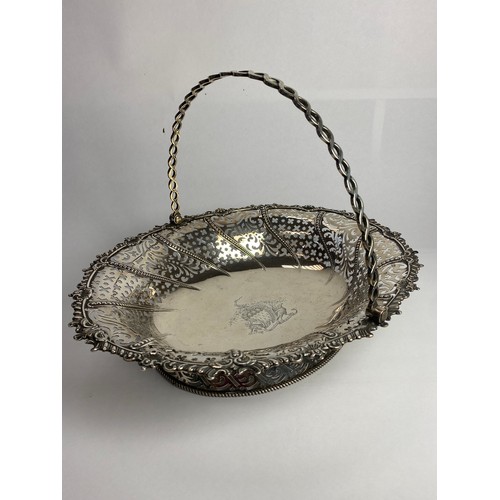 7008 - An Edward Aldridge I & Edward Aldridge II lightly ornate silver pierced bread basket with swing hand... 