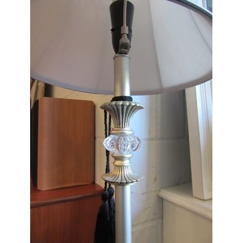 1004 - A pair of modern standard lamps, with cream shades, 154cm height