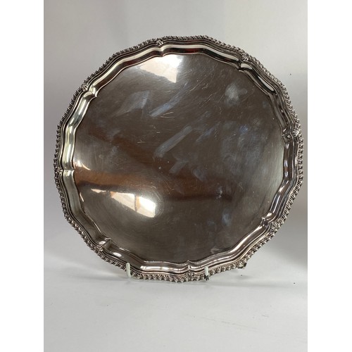 7011 - Two silver salvers: Barker brothers Birmingham 1937, 25.5cm diameter. Walker and Hall, Sheffield 196... 