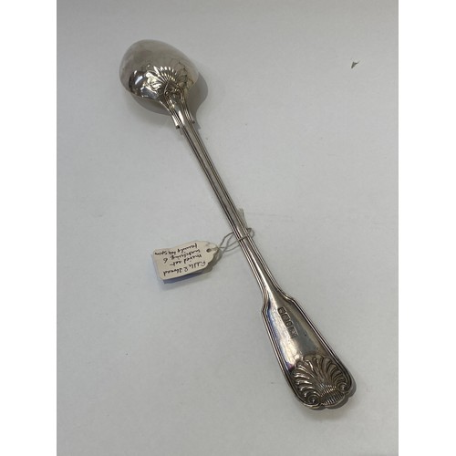 7104 - A Joseph Rogers and sons silver basting spoon in fiddle and thread pattern with antler crest detail.... 