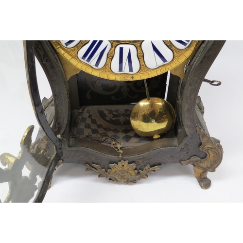 8058 - A 19th Century French bracket clock of balloon form with decorative ormolu mounts. Brass dial with e... 