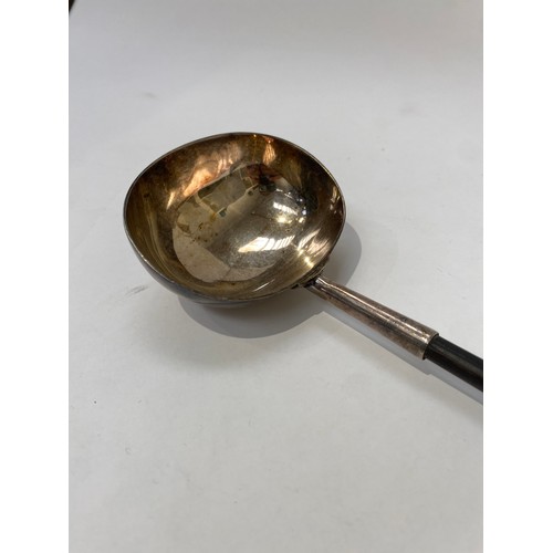 7101 - A Georgian toddy ladle unmarked with whale bone handle, 35cm long