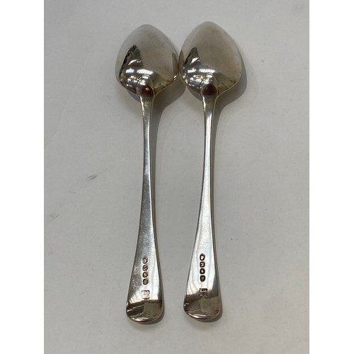 7106 - A pair of Peter and William Bateman silver serving spoons with monogram and crest to terminal, Londo... 