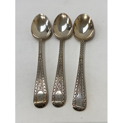 7107 - A set of 12 Victorian teaspoons and sugar tongs by TM and Co London 1885  with bright cut detail, mo... 