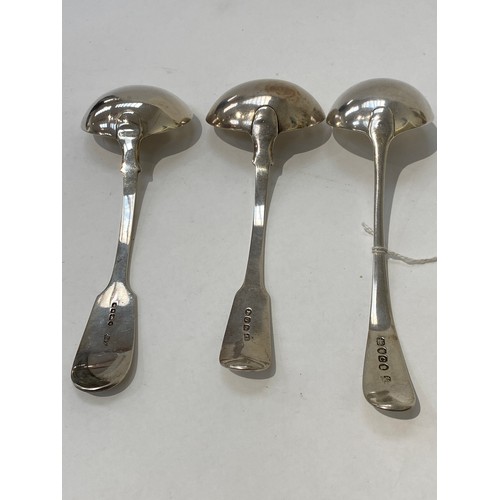 7094 - Three silver ladles, two Georgian and one Victorian, one with monogram to terminal, 197g